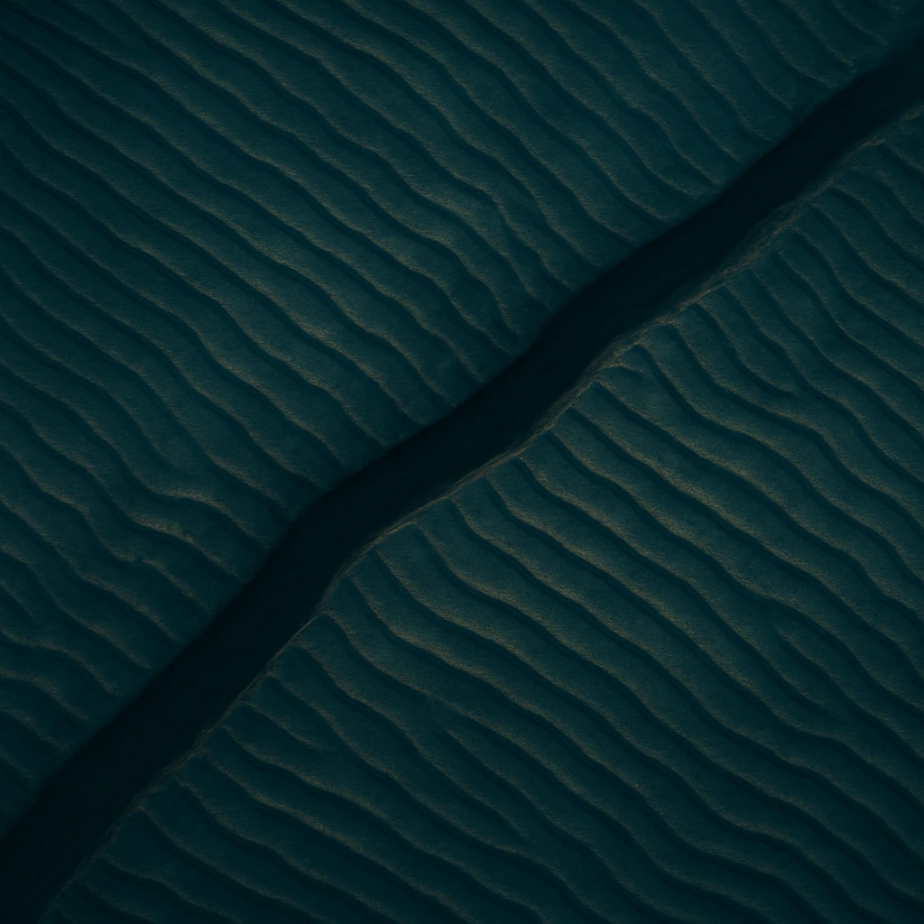 Moody aerial terrain in navy-teal with warm gold highlights — The Matchbox case study cover image for Anomalo